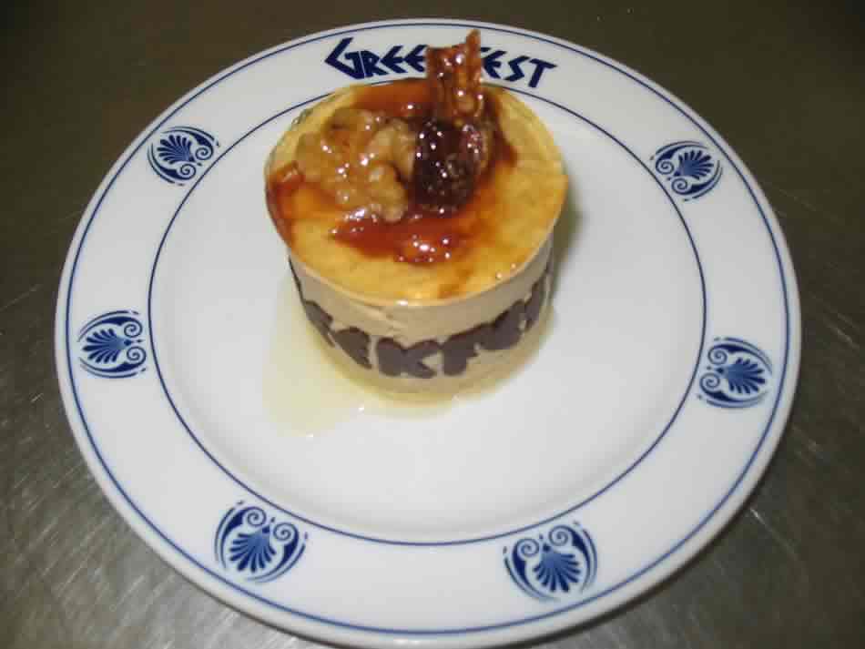 Fig mousse and black tea mousse with white sponge decorated with a walnut, fig, raisin and chocolate
